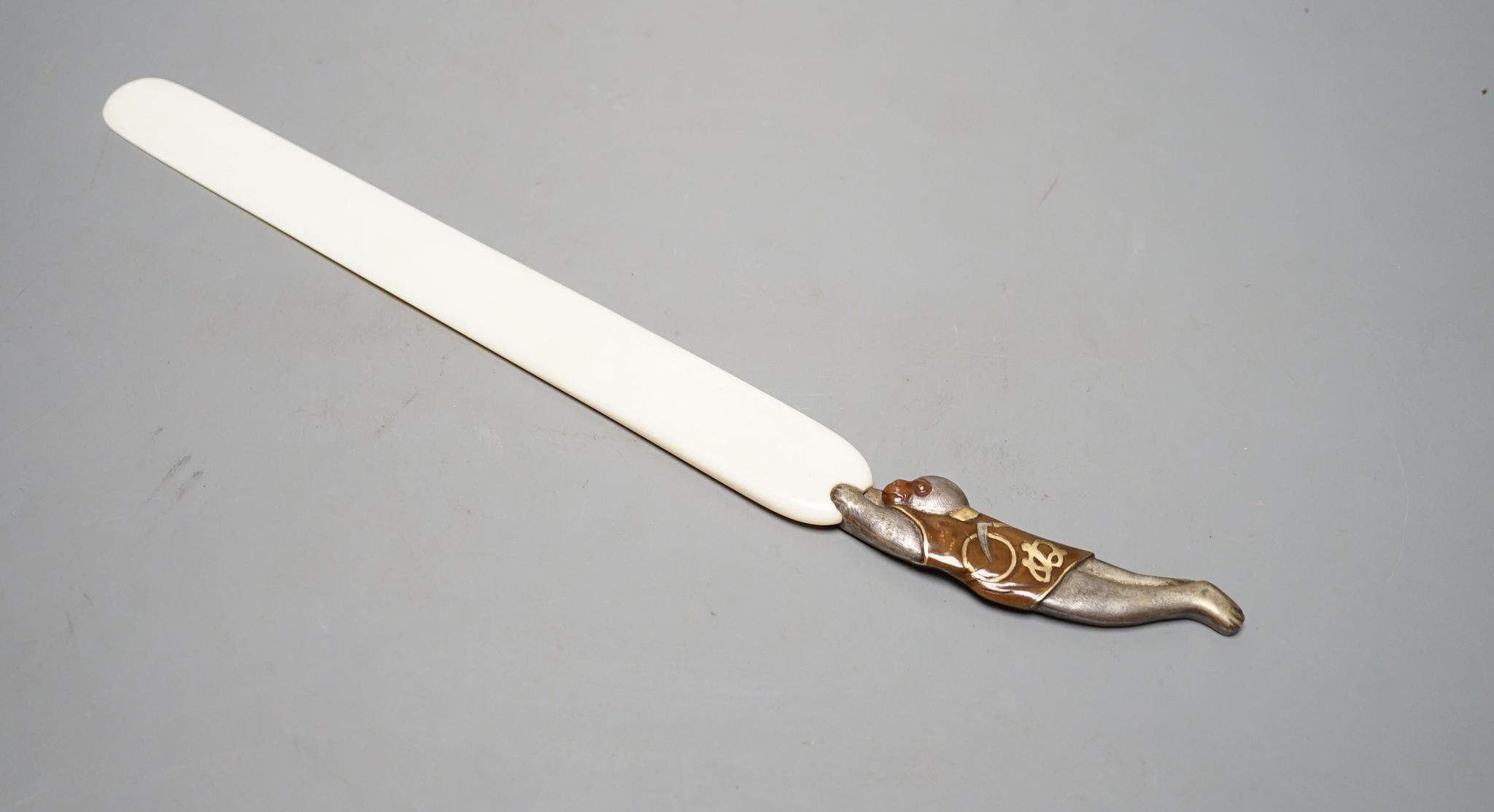 A Japanese mixed metal and ivory page turner, 38 cms long.